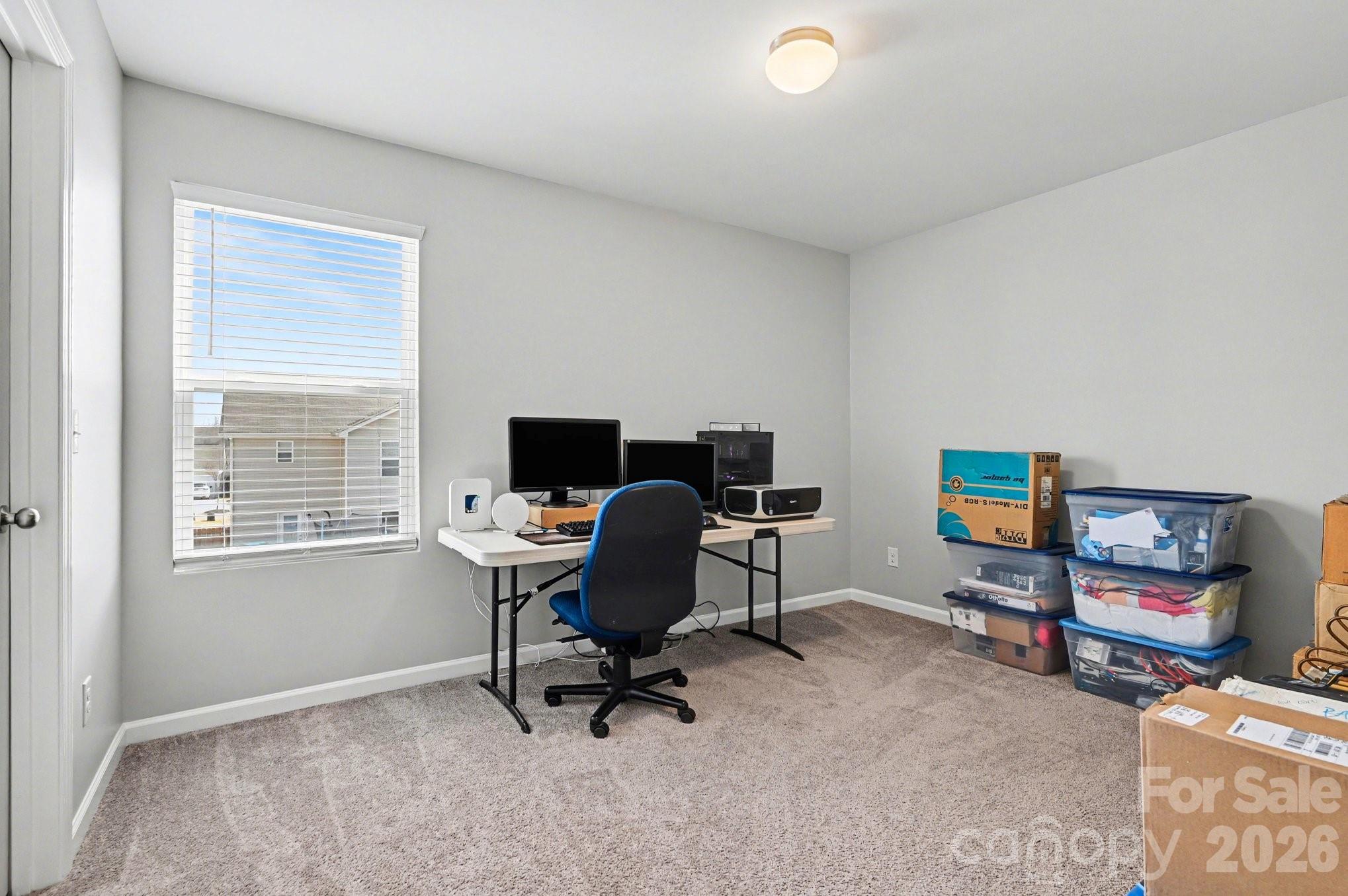 12527 Gotland Road Midland, NC 28107 - Photo 11 of 24 a view of a workspace with furniture and a window