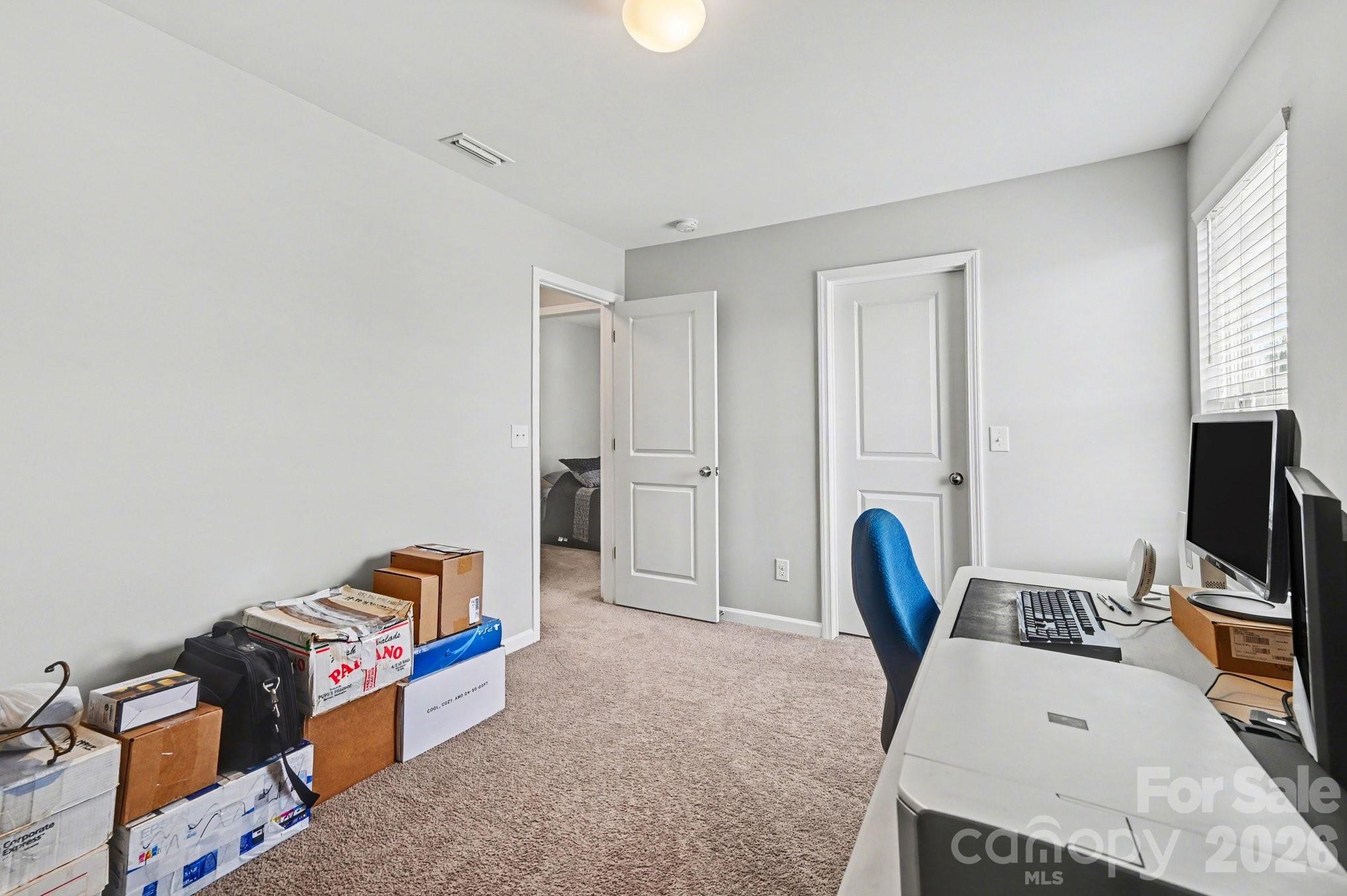 12527 Gotland Road Midland, NC 28107 - Photo 12 of 24 a living room with furniture a flat screen tv and a window