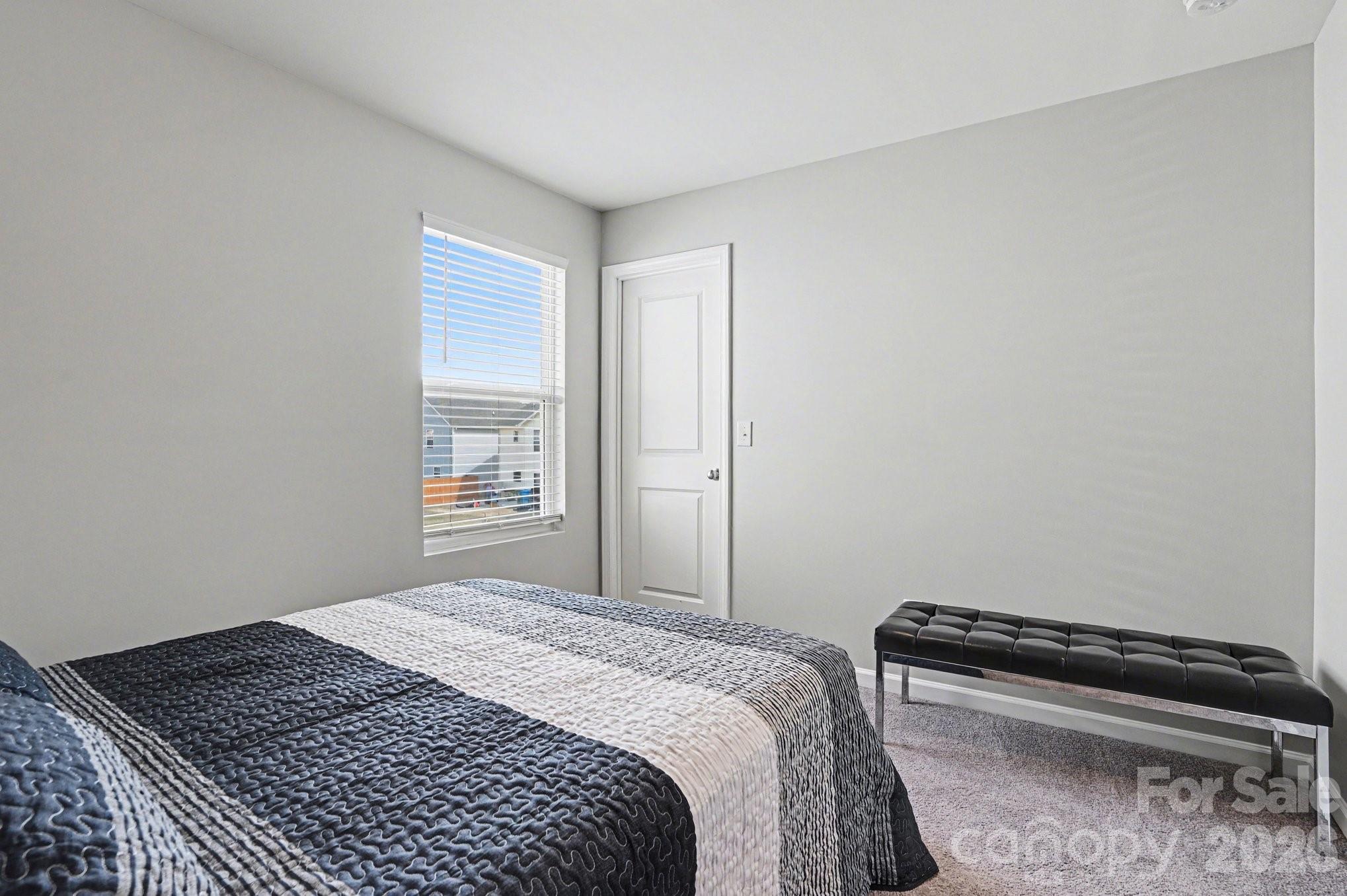 12527 Gotland Road Midland, NC 28107 - Photo 15 of 24 a bedroom with a bed and a window