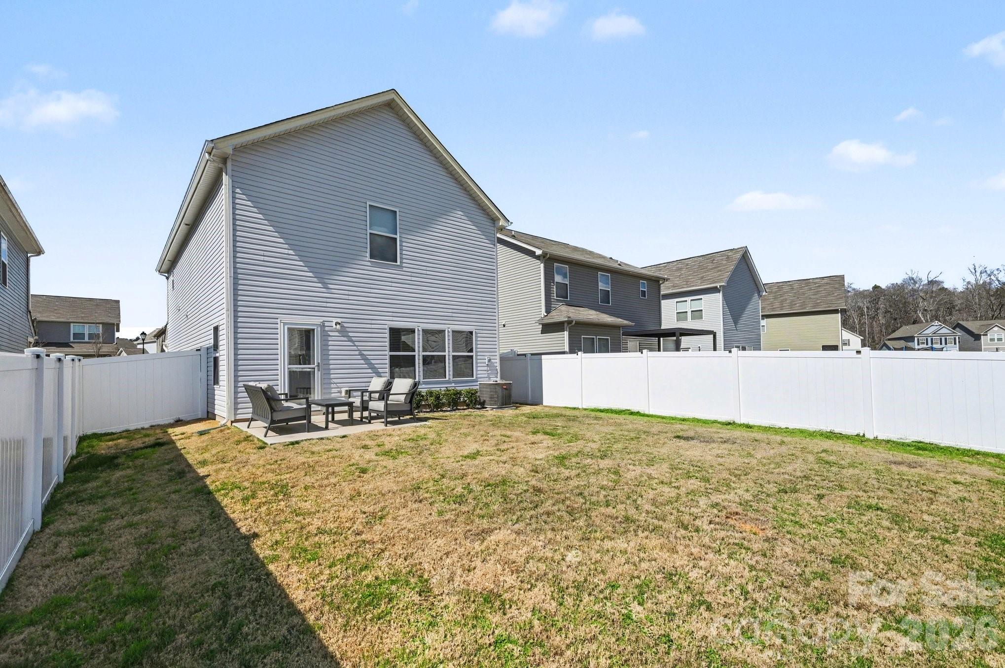 12527 Gotland Road Midland, NC 28107 - Photo 20 of 24 a view of a house with a yard and sitting area