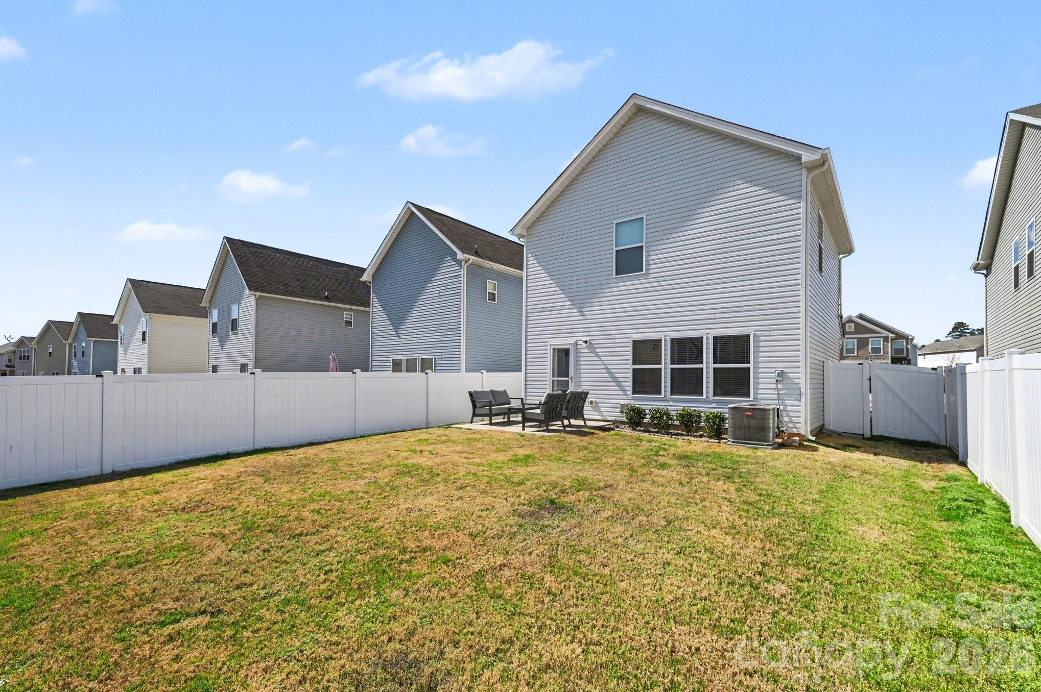 12527 Gotland Road Midland, NC 28107 - Photo 23 of 24 a view of a house with swimming pool and porch