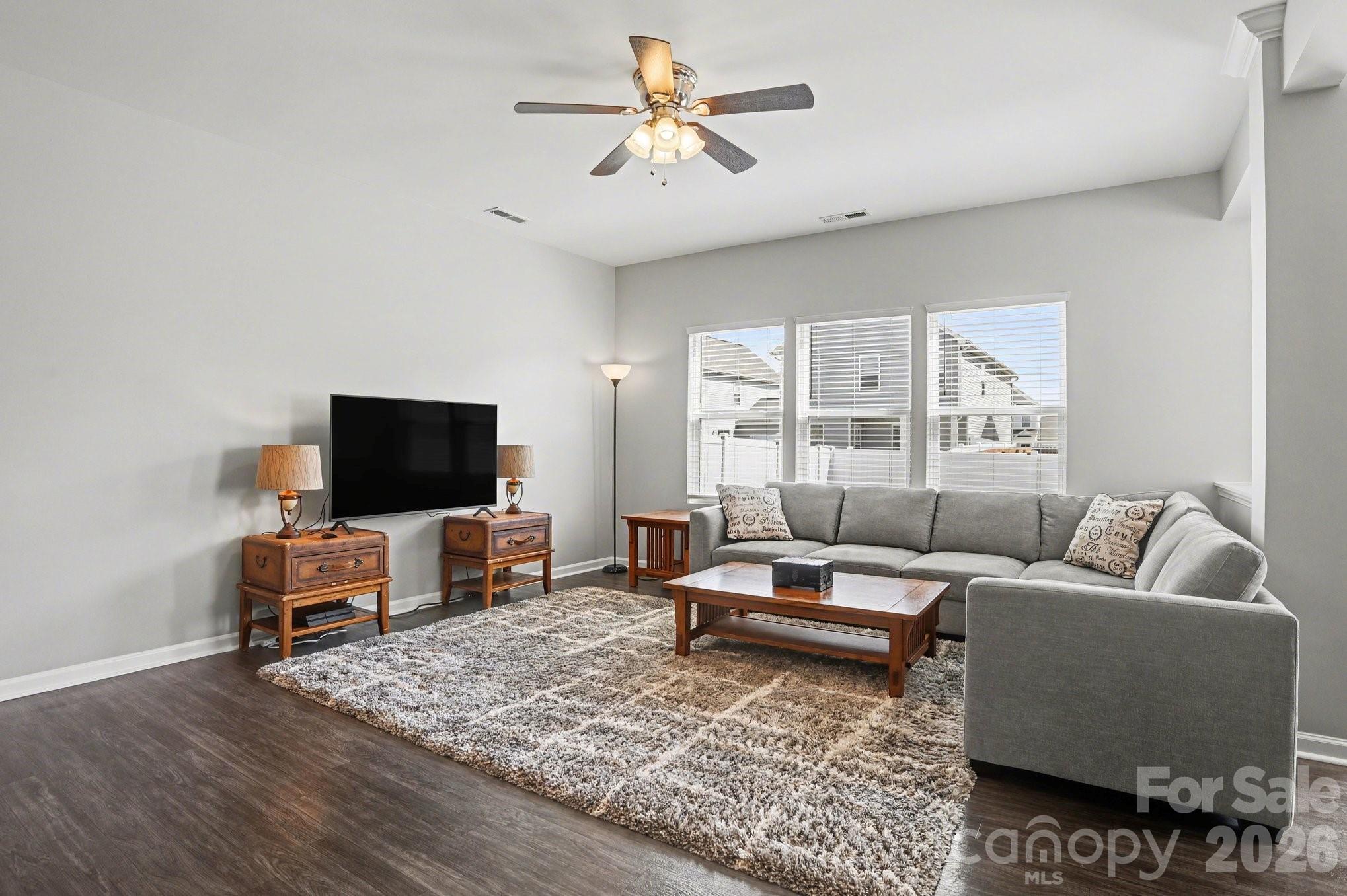 12527 Gotland Road Midland, NC 28107 - Photo 3 of 24 a living room with furniture and a flat screen tv