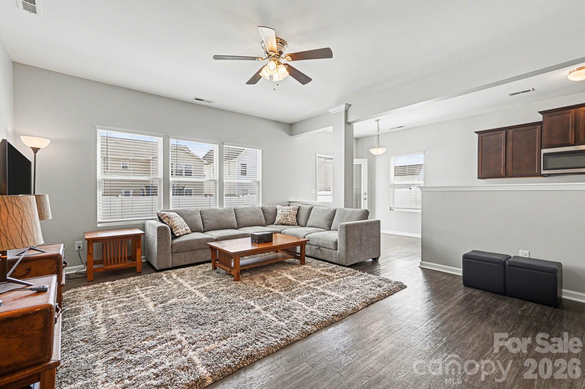 12527 Gotland Road Midland, NC 28107 - Photo 4 of 24 a living room with furniture ceiling fan and a rug