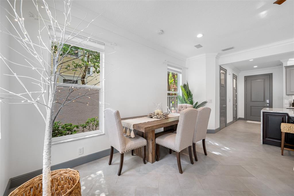 237 7th Avenue North, Unit 2 St. Petersburg, FL 33701 - Photo 22 of 60 a view of a dining room with furniture window and outside view