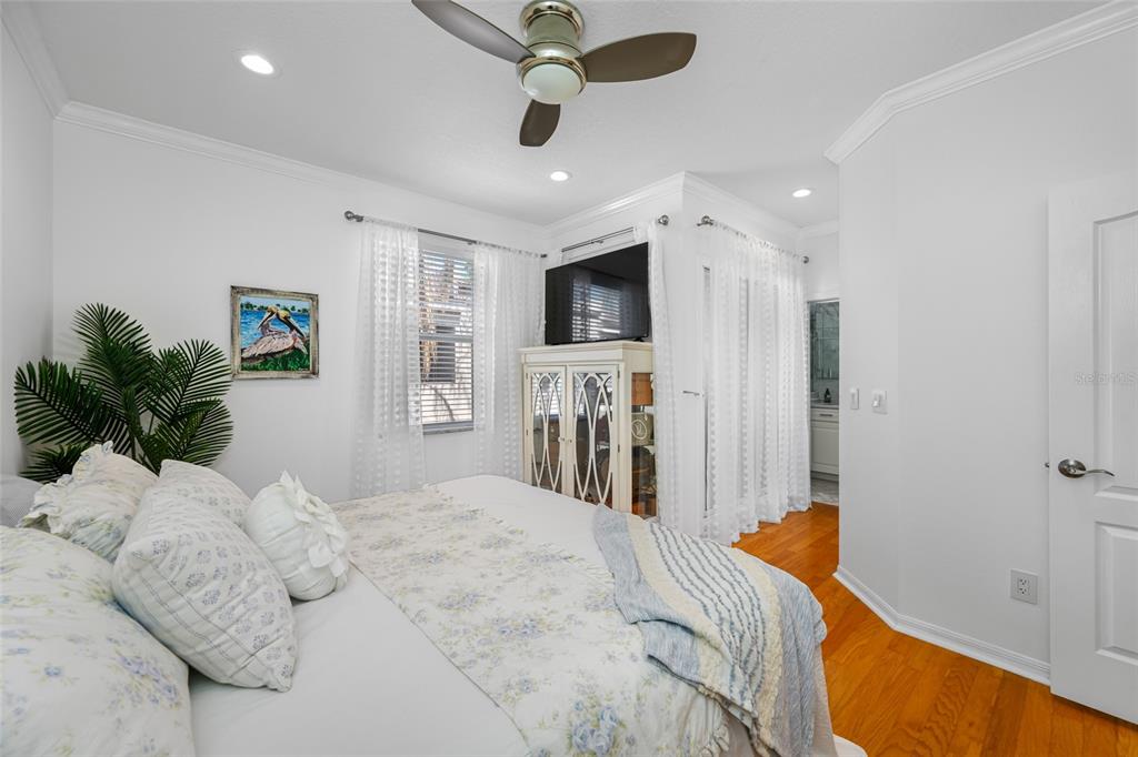 237 7th Avenue North, Unit 2 St. Petersburg, FL 33701 - Photo 30 of 60 a bed room with a bed mirror and a window