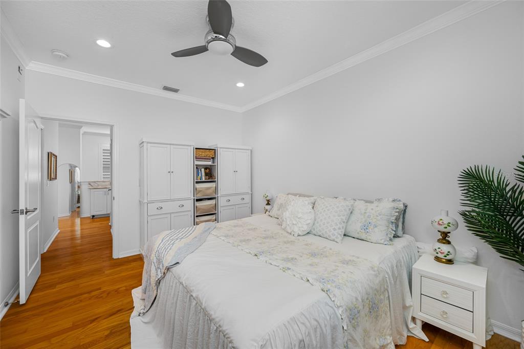 237 7th Avenue North, Unit 2 St. Petersburg, FL 33701 - Photo 32 of 60 a bedroom with a bed and wooden floor
