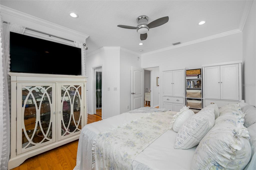 237 7th Avenue North, Unit 2 St. Petersburg, FL 33701 - Photo 33 of 60 a bedroom with a bed and a flat screen tv