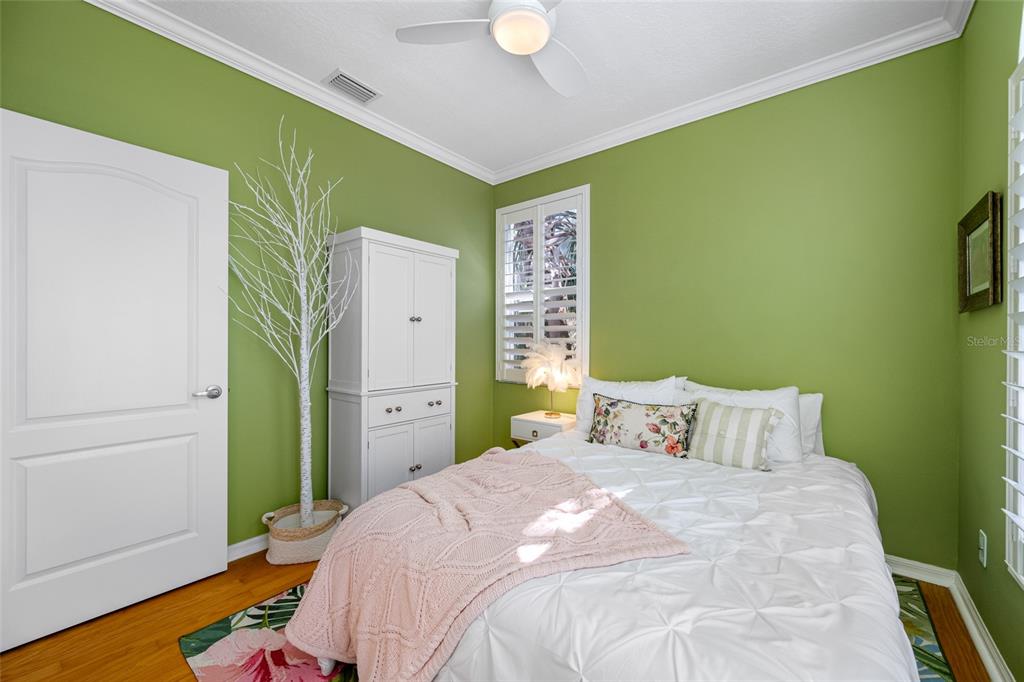 237 7th Avenue North, Unit 2 St. Petersburg, FL 33701 - Photo 40 of 60 a bedroom with a bed and a dresser