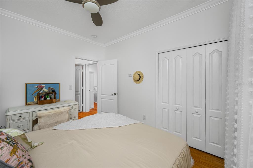 237 7th Avenue North, Unit 2 St. Petersburg, FL 33701 - Photo 46 of 60 a bedroom with a bed and a chandelier