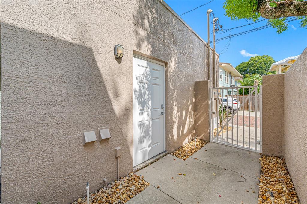 237 7th Avenue North, Unit 2 St. Petersburg, FL 33701 - Photo 50 of 60 a view of a wooden door and outdoor space