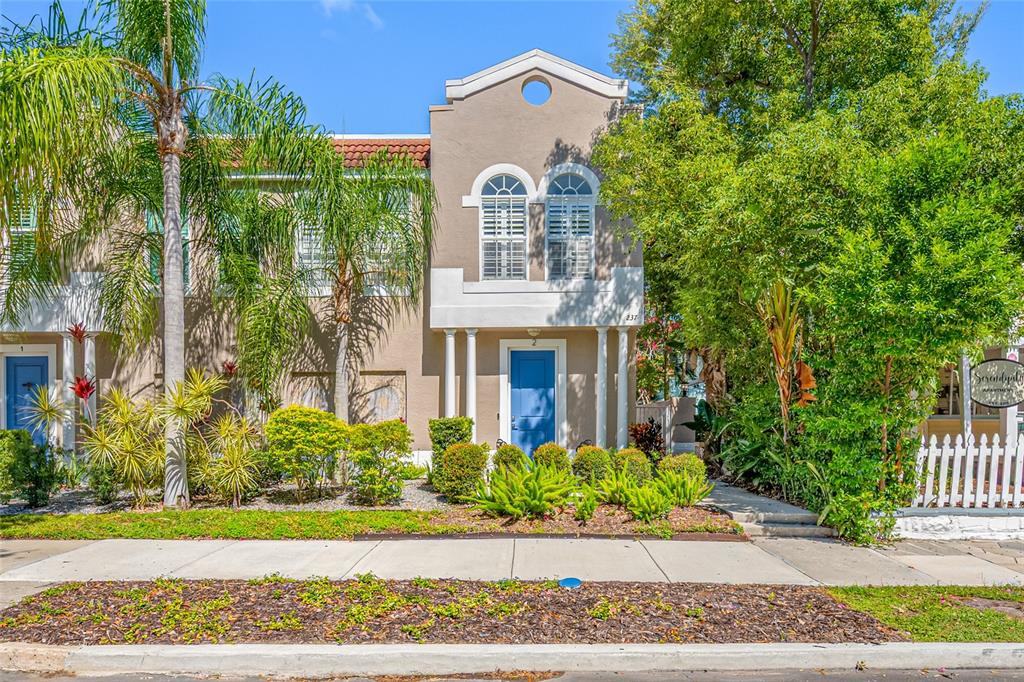 237 7th Avenue North, Unit 2 St. Petersburg, FL 33701 - Photo 56 of 60 a front view of a house with a garden