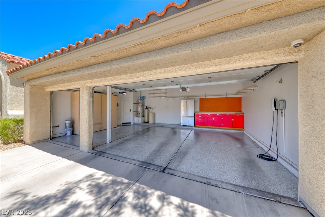 2122 Mooreview Street Henderson, NV 89012 - Photo 34 of 44 Ample two-car garage offers convenient direct home access and durable epoxy flooring.