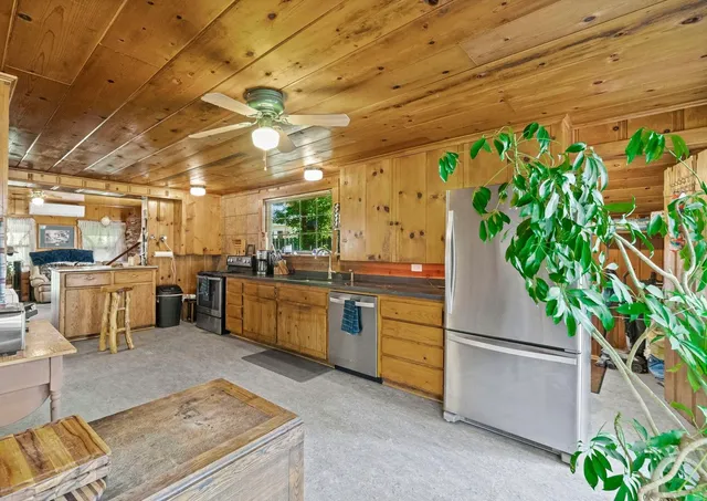 a bathroom with a sink mirror and toilet