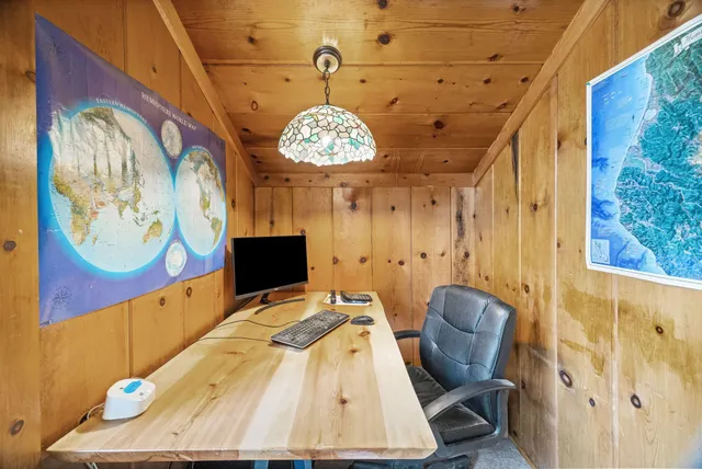 a view of a livingroom with furniture and a window