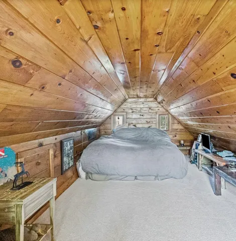 a kitchen with a refrigerator a sink and cabinets