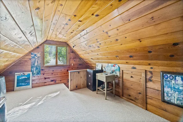 a spacious bedroom with a bed and a table