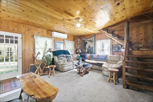 a large kitchen with a large window and stainless steel appliances