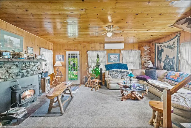 a view of an outdoor dining space with a table and chairs