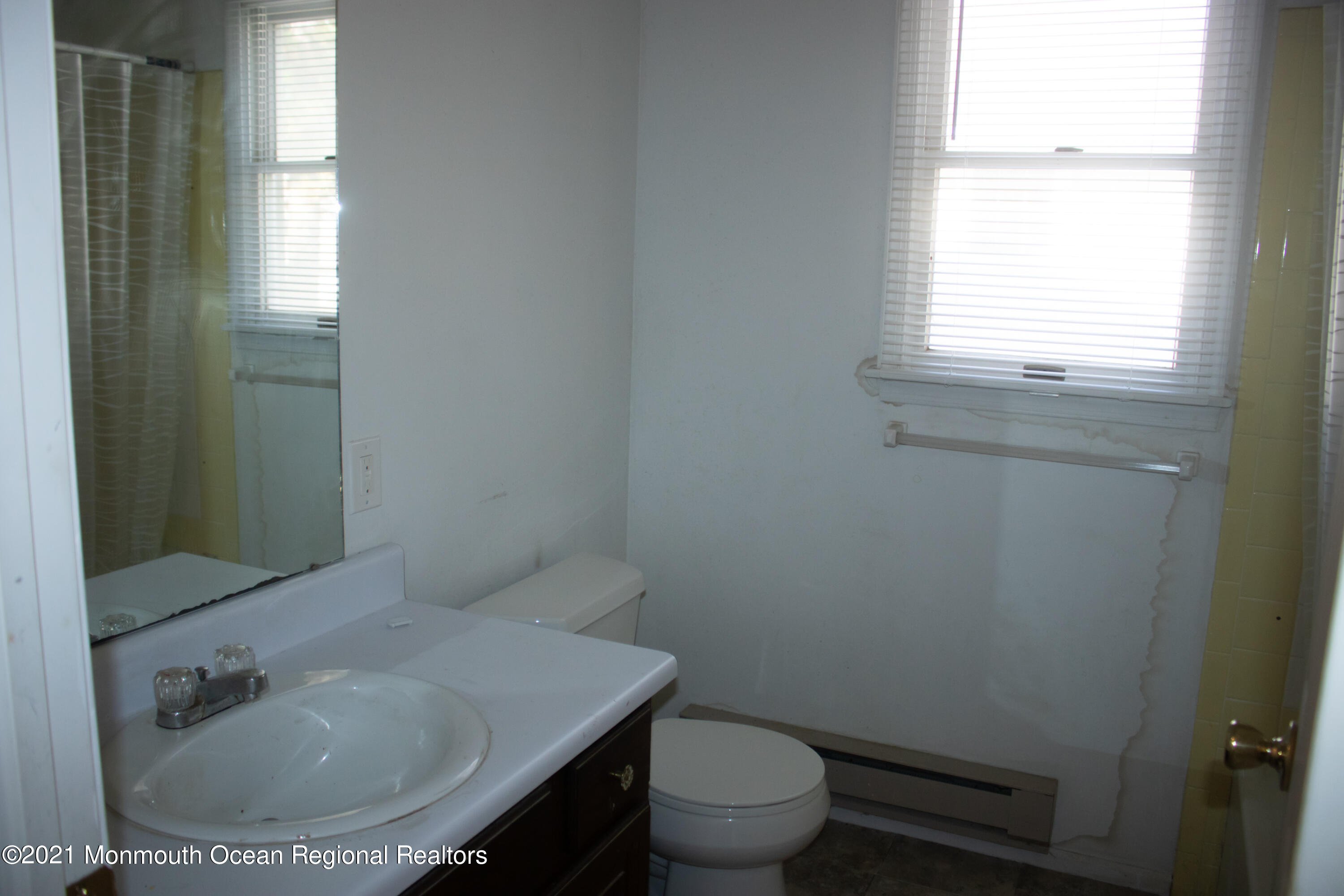 47 Sycamore Access Road Manahawkin, NJ 08050 - Photo 23 of 37 a bathroom with a sink toilet and window