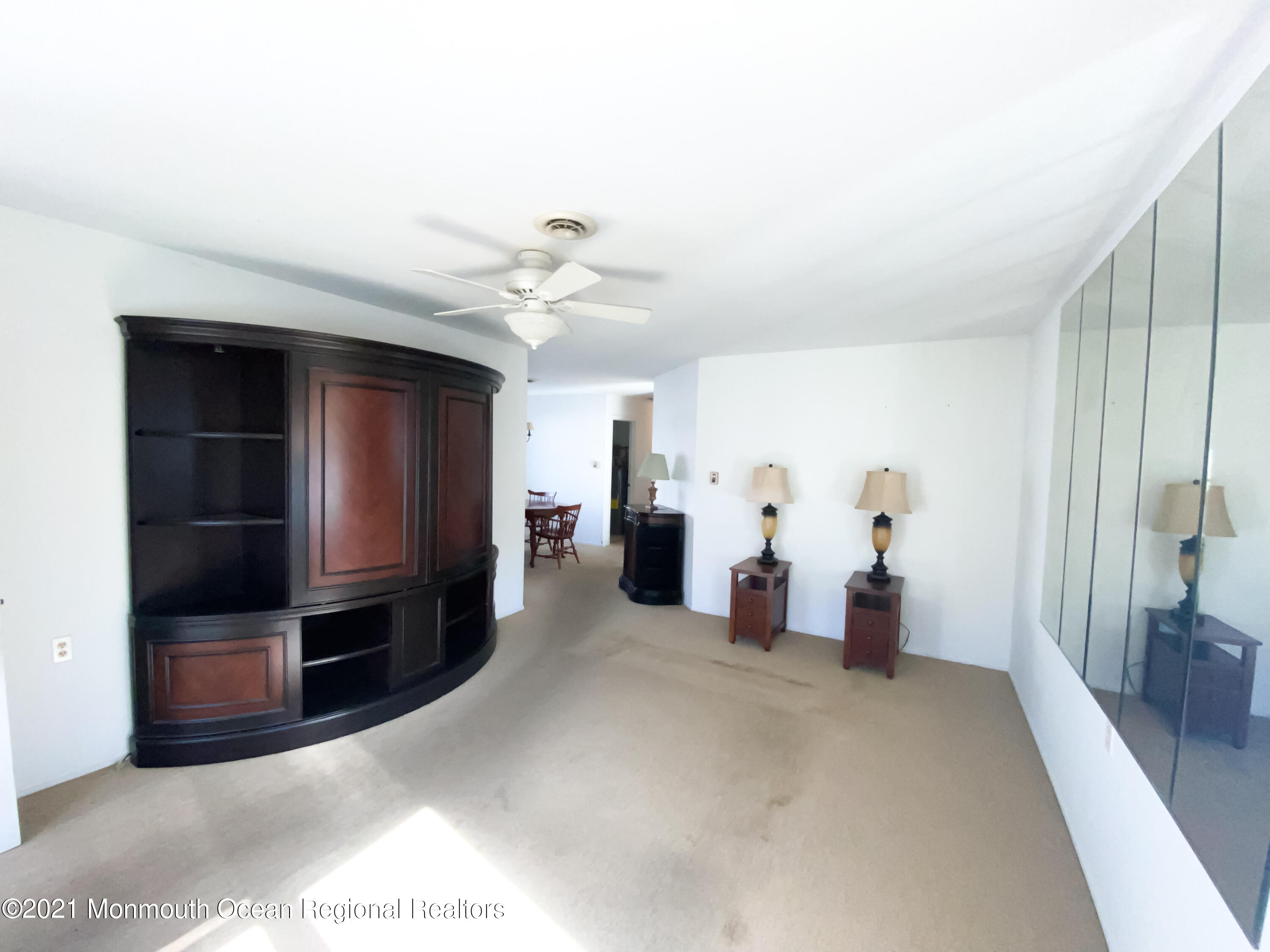47 Sycamore Access Road Manahawkin, NJ 08050 - Photo 6 of 37 a view of a livingroom with furniture and an empty room