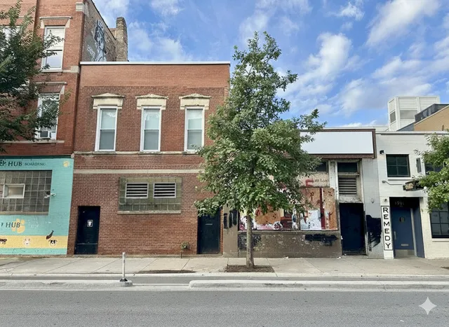 a view of a house with a street