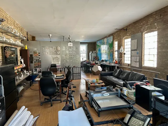 a living room with lots of furniture and gym equipment
