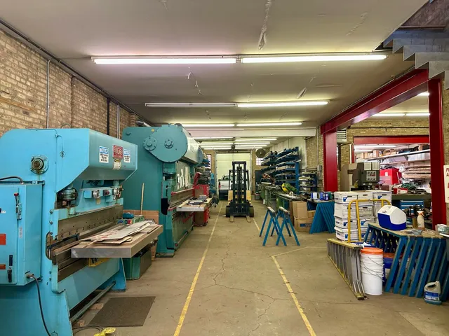 a living room filled with furniture and a chandelier