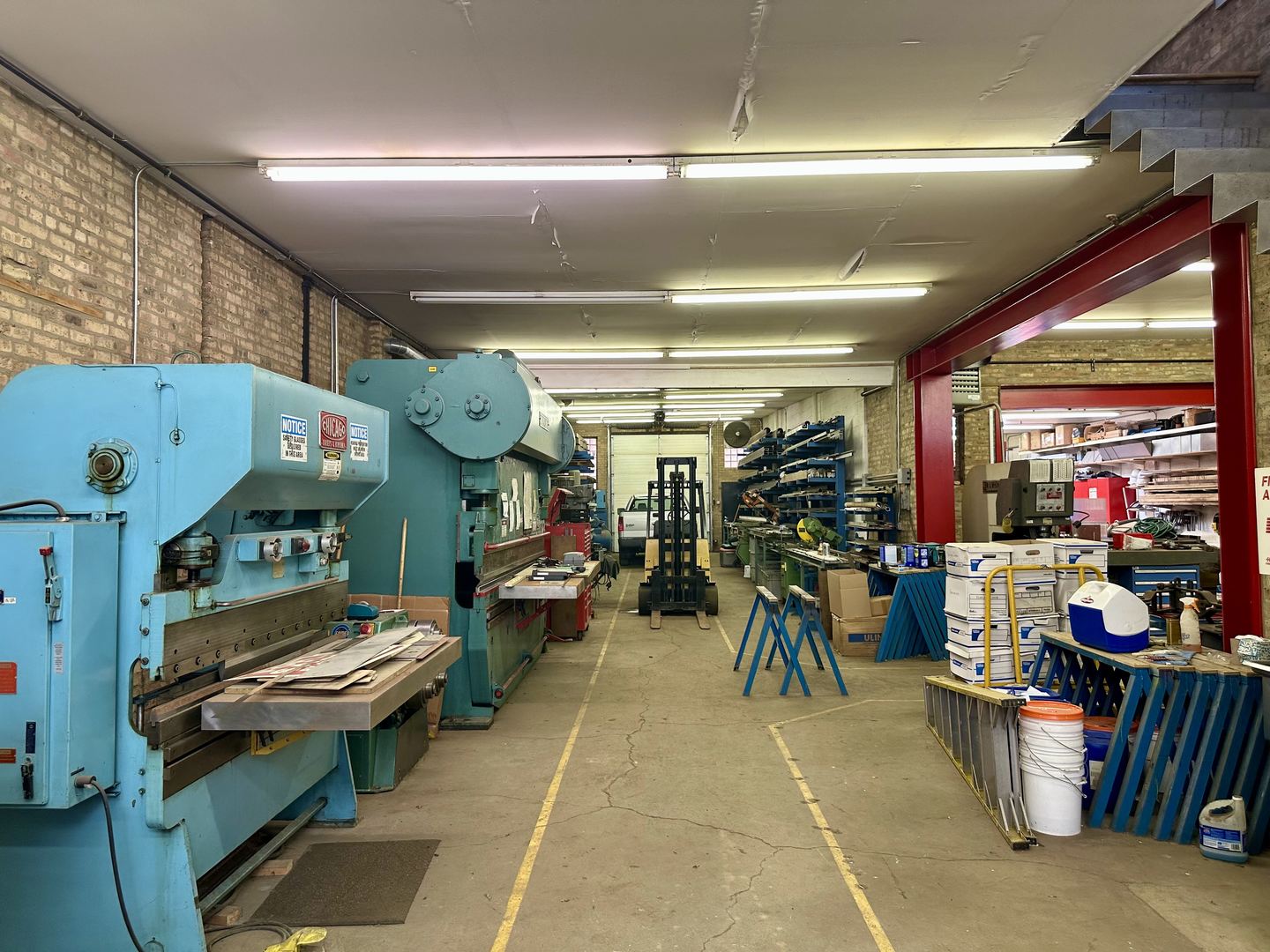1906-1908 North Milwaukee Avenue Chicago, IL 60647 - Photo 4 of 32 a living room filled with furniture and a chandelier