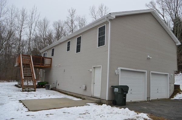 247 Collins Road Hardwick, MA 01082 - Photo 15 of 16 a front view of a house with garden