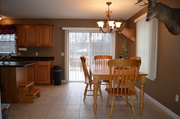 247 Collins Road Hardwick, MA 01082 - Photo 2 of 16 a view of a dining room with furniture and a chandelier