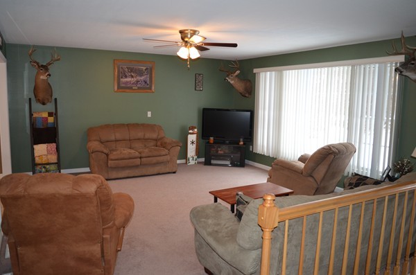 247 Collins Road Hardwick, MA 01082 - Photo 4 of 16 a living room with furniture a ceiling fan and a window