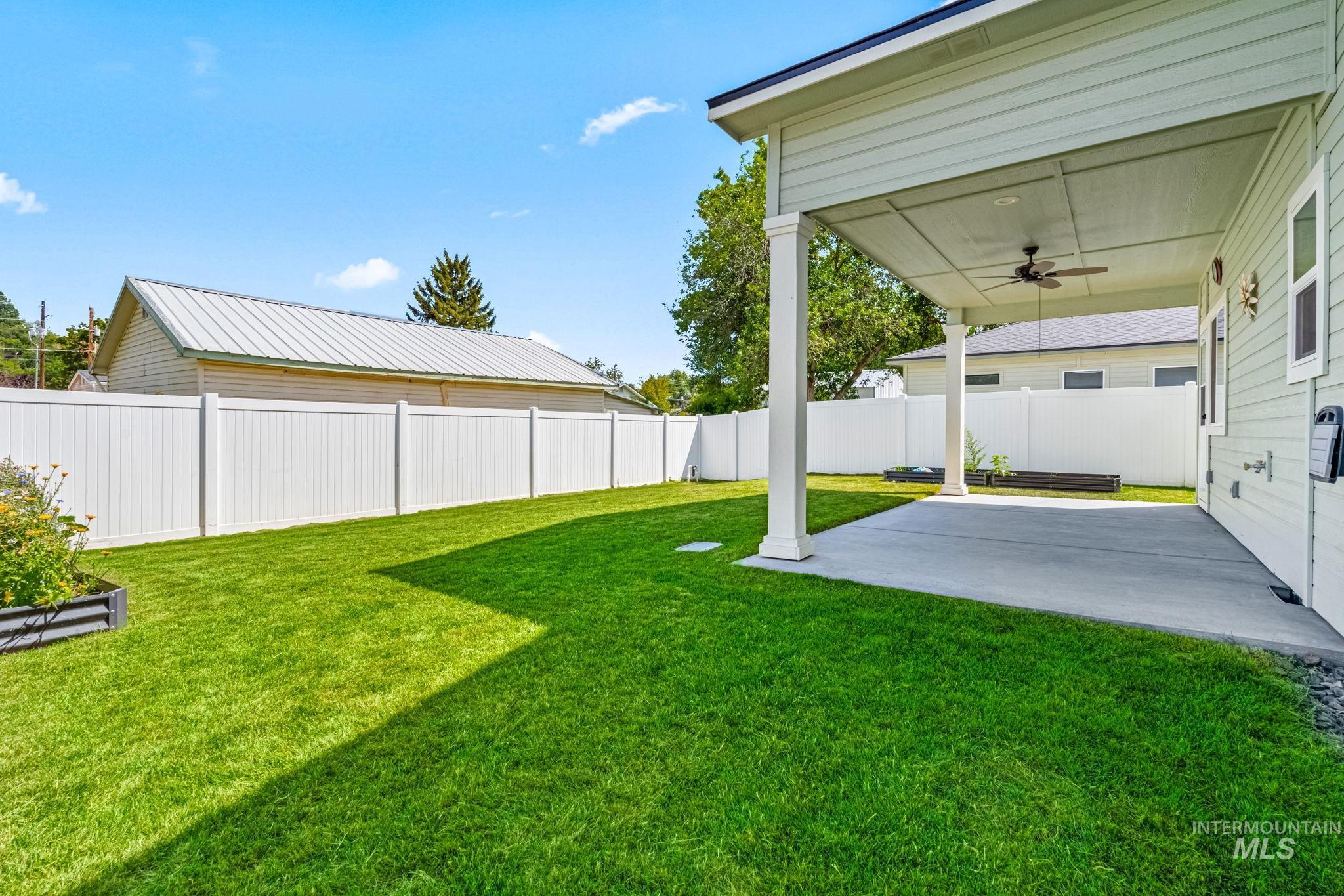 395 Cutlass Payette, ID 83661 - Photo 22 of 26 Fenced backyard with a patio and a ceiling fan