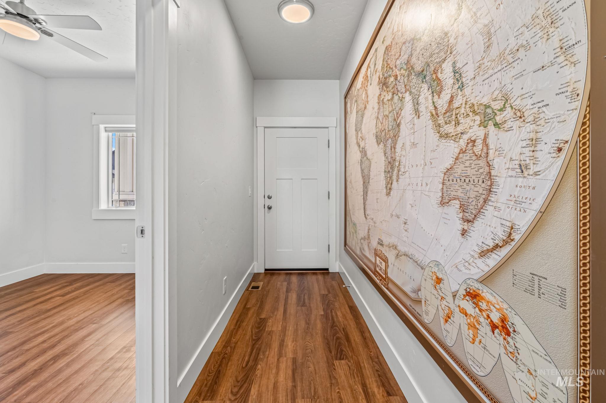 395 Cutlass Payette, ID 83661 - Photo 5 of 26 Hallway featuring baseboards and dark wood-type flooring