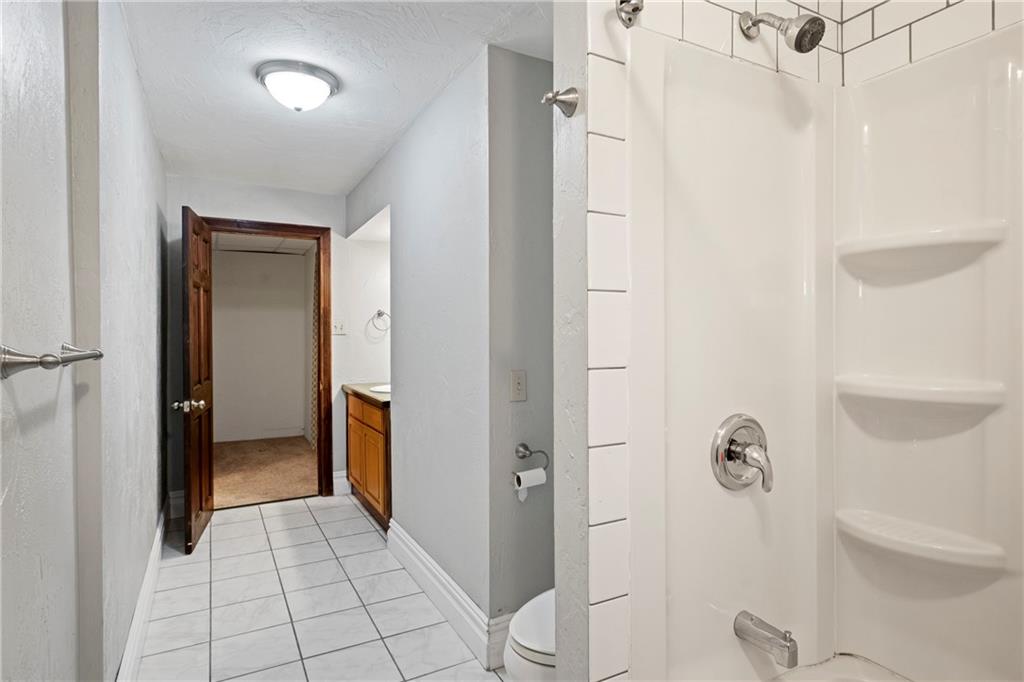 2725 Sumner Street Pittsburgh, PA 15203 - Photo 19 of 37 a bathroom with a shower and toilet