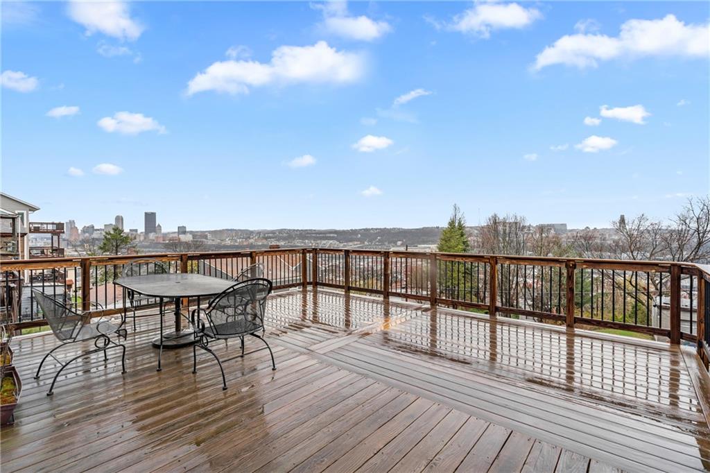 2725 Sumner Street Pittsburgh, PA 15203 - Photo 2 of 37 a view of a balcony with chairs and wooden floor