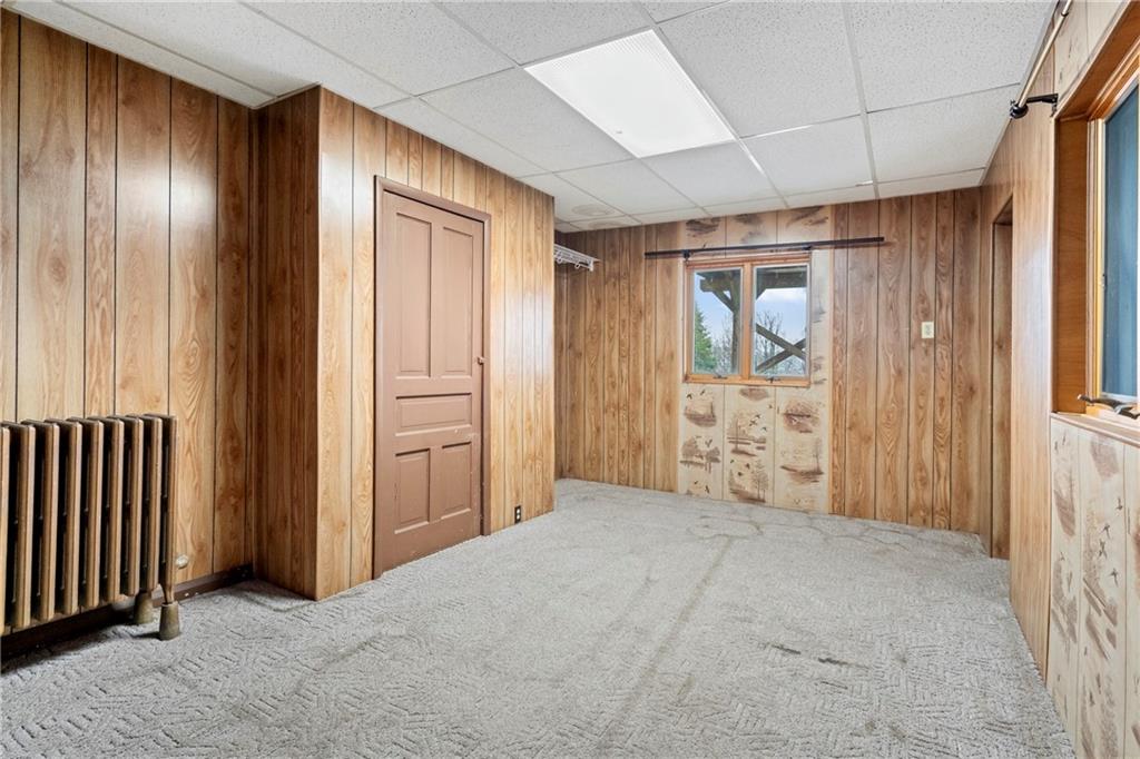 2725 Sumner Street Pittsburgh, PA 15203 - Photo 27 of 37 an empty room with closet and wooden door