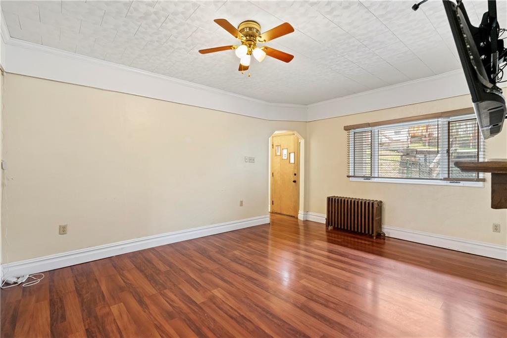 2725 Sumner Street Pittsburgh, PA 15203 - Photo 5 of 37 a view of room with window and wooden floor