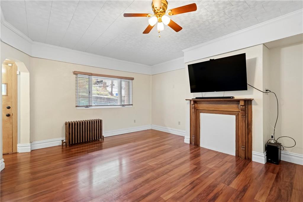 2725 Sumner Street Pittsburgh, PA 15203 - Photo 6 of 37 wooden floor in an empty room with a window