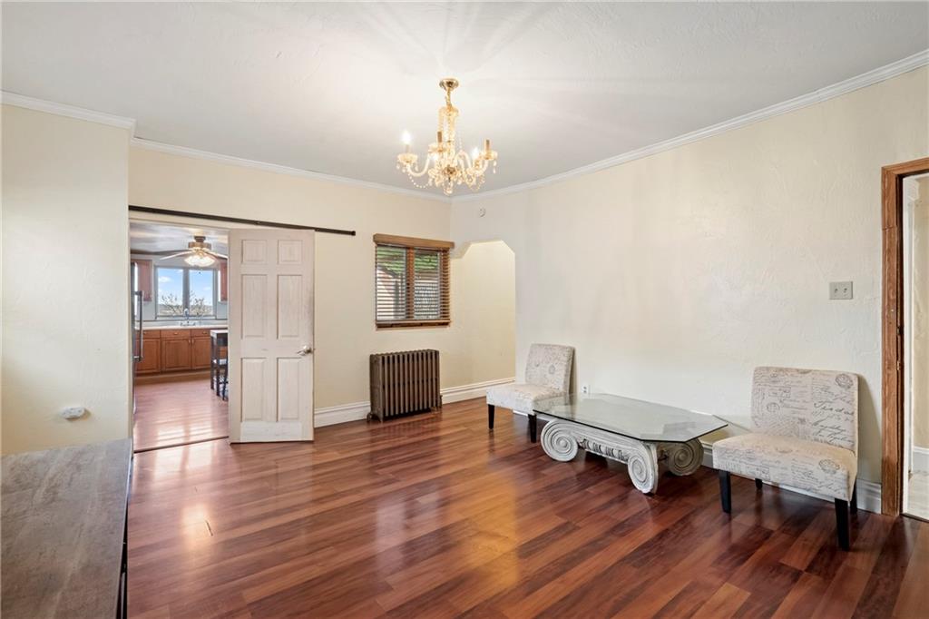 2725 Sumner Street Pittsburgh, PA 15203 - Photo 7 of 37 a living room with furniture and a chandelier