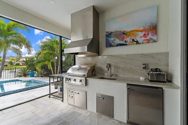 a room with pool table and wall paintings