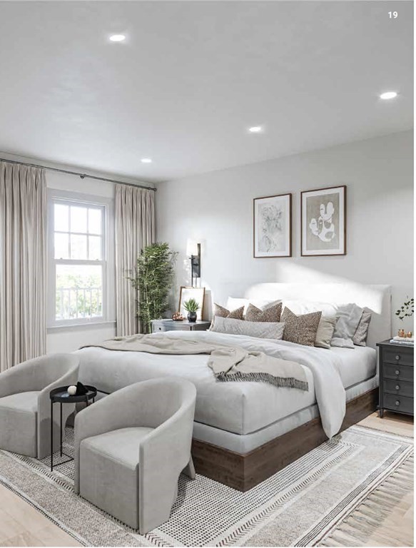 31 Boardman Street, Unit 2 Boston, MA 02128 - Photo 3 of 8 a spacious bedroom with a bed and a couch