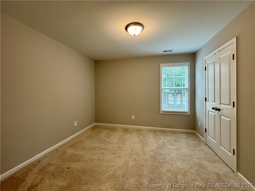 808 Jackson Street Raeford, NC 28376 - Photo 13 of 21 an empty room with windows