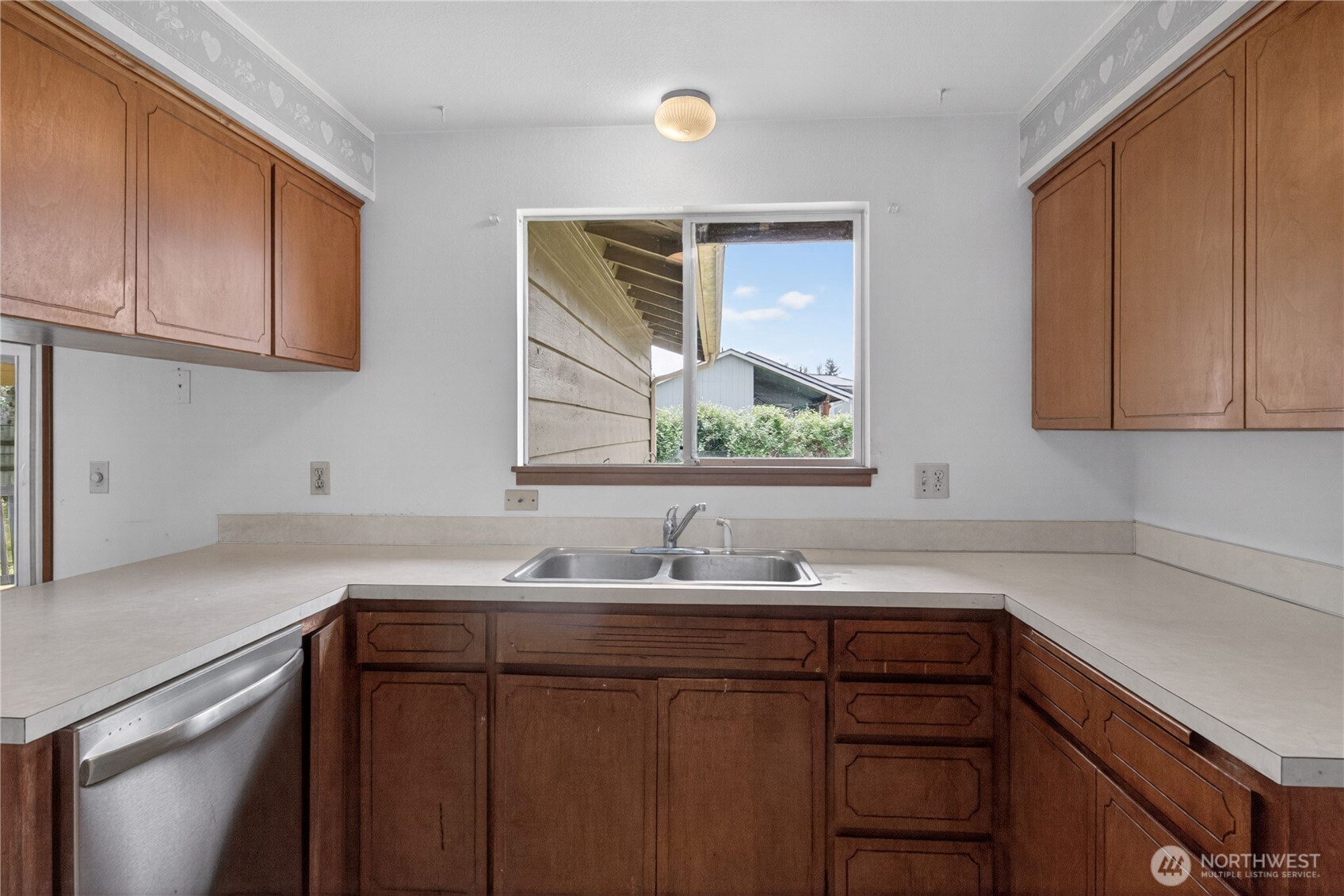 716 Murphy Way Sultan, WA 98294 - Photo 14 of 31 a sink with cabinets and window