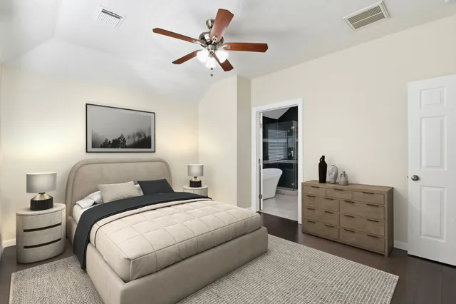 a bedroom with a bed and a dresser