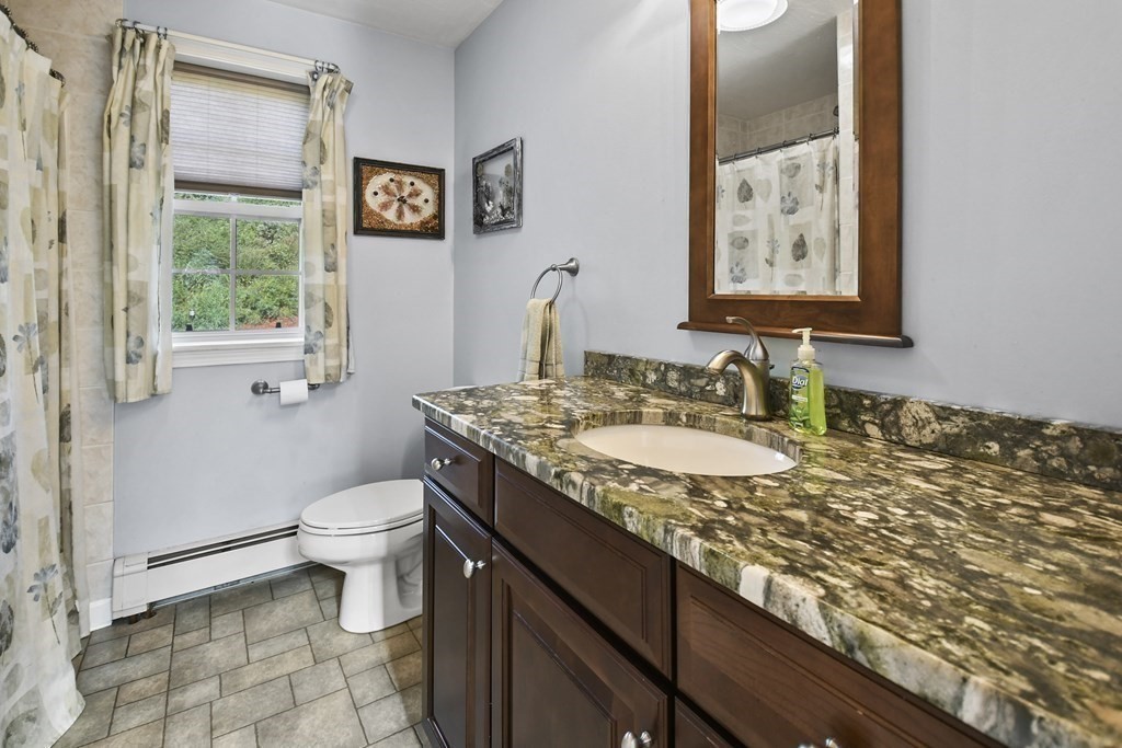 82 Buttermilk Road Leominster, MA 01453 - Photo 15 of 42 a bathroom with a granite countertop sink and a toilet