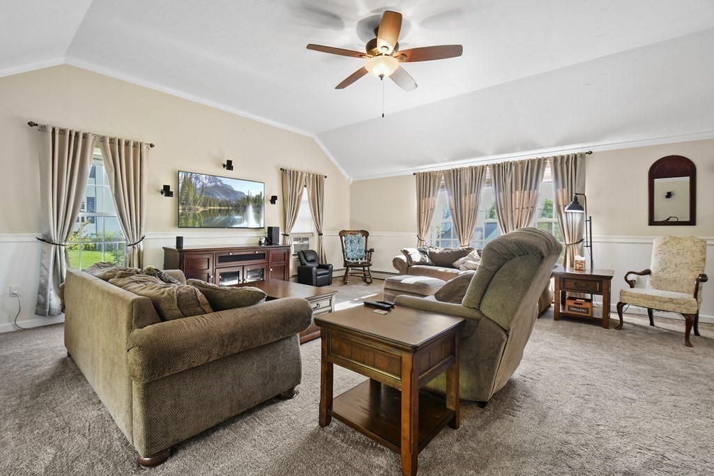82 Buttermilk Road Leominster, MA 01453 - Photo 17 of 42 a living room with furniture and a flat screen tv