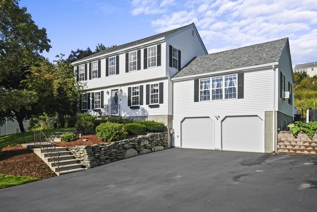 82 Buttermilk Road Leominster, MA 01453 - Photo 2 of 42 a front view of a house with a yard