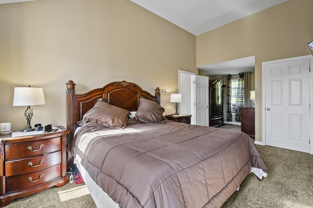 82 Buttermilk Road Leominster, MA 01453 - Photo 21 of 42 a bedroom with a bed and a lamp on dresser