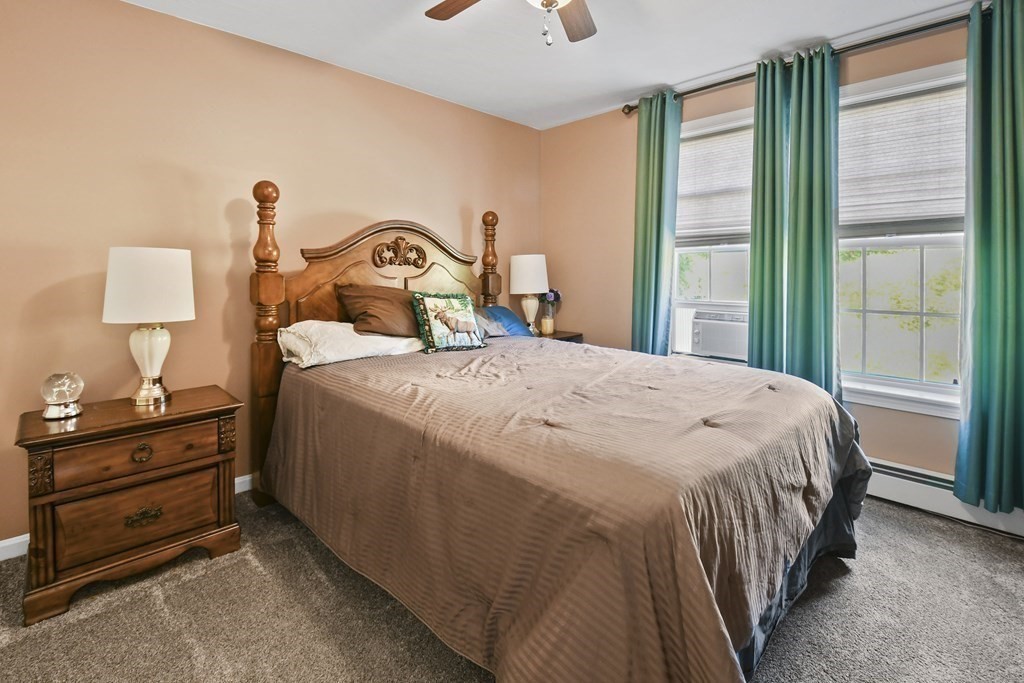 82 Buttermilk Road Leominster, MA 01453 - Photo 23 of 42 a bedroom with a bed and a lamp on table