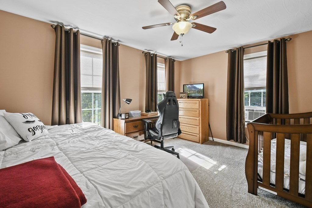 82 Buttermilk Road Leominster, MA 01453 - Photo 25 of 42 a bedroom with a bed dresser and a large window